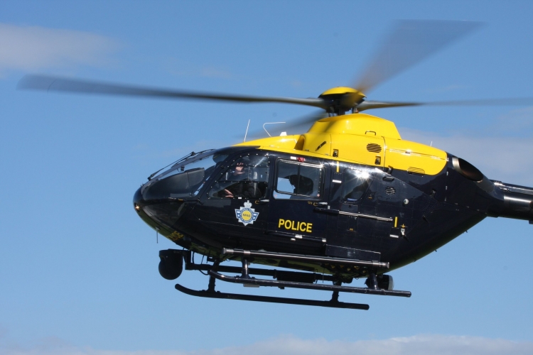 Police helicopter called in to assist in search for wanted suspect in ...