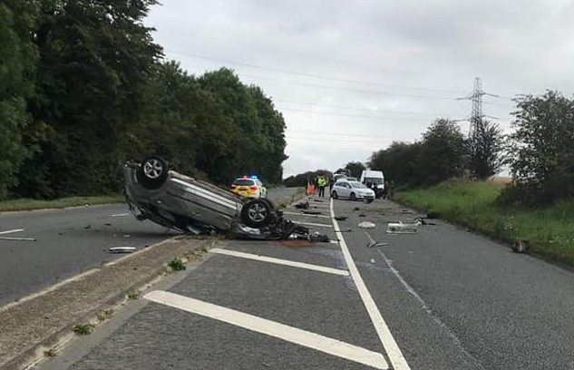 Road closed in both directions as car overturns in crash on A361