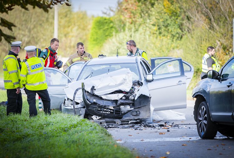 PICTURES: Woman hospitalised after head-on crash on road near Swindon